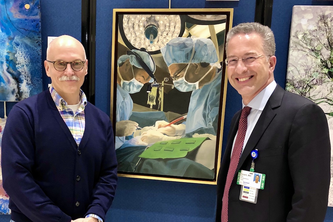Color photo of Dr. Ron Israeli and his oil painting teacher, David Peikon, posing next to a piece of art.