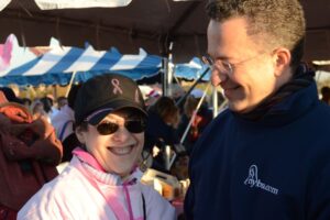 Dr. Israeli stands with a patient in a baseball cap at Making Strides of Long Island 2012