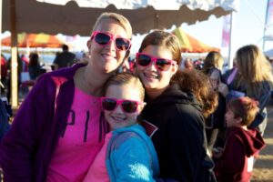 Woman and two teens smiling atMaking Strides of Long Island 2013
