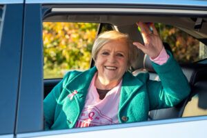 Woman smiling from backseat of car atMaking Strides 2020 Drive Through photo