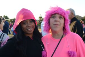Two women pose at Making Strides of Long Island 2012. The woman on the right is wearing a pink wig.