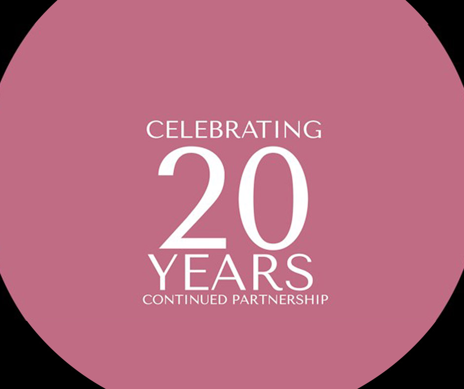 Pink color circle with black background and text: Celebrating 20 Years of Continued Partnership