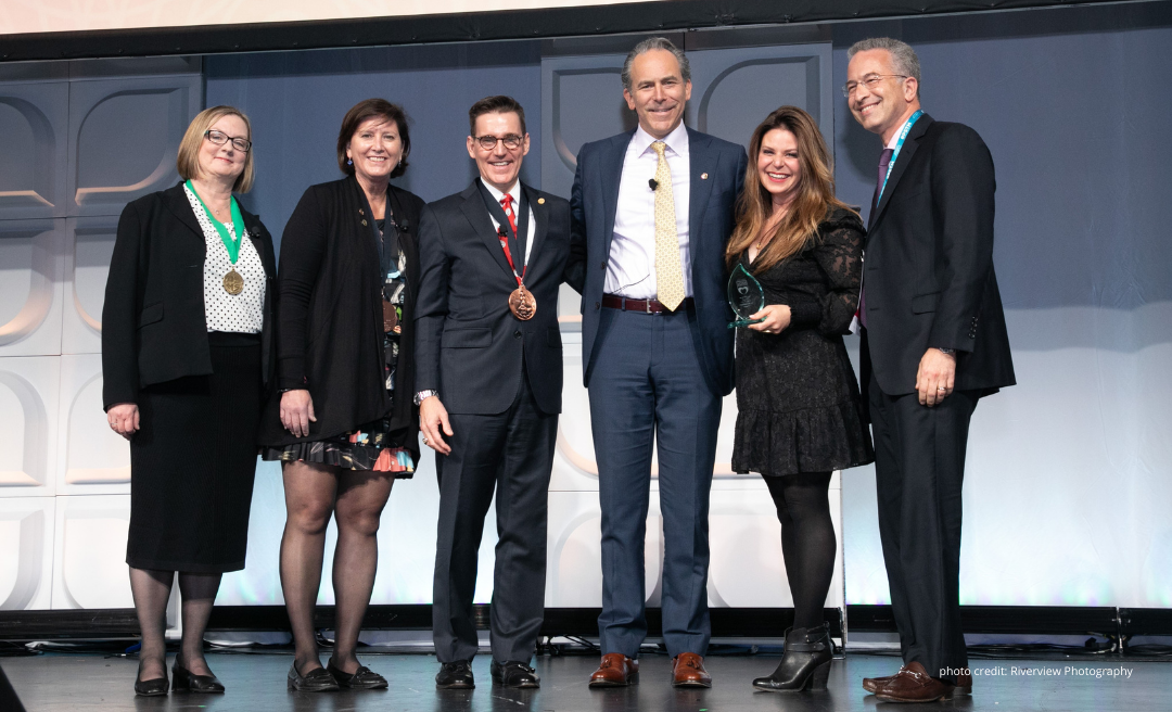 Group photo of Jen Rozenbaum accepting ASPS award