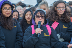 Annie on microphone at Making Strides of Long Island 2018