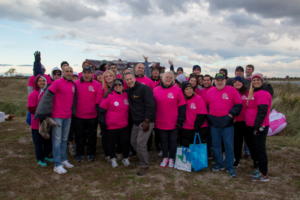 Group shot of 20 ppl in hot pink shirts at Making Strides of Long Island 2018