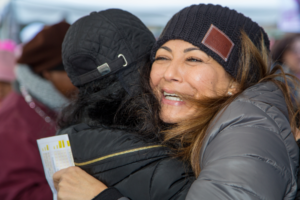 Two women hugging at Making Strides of Long Island 2018 photo