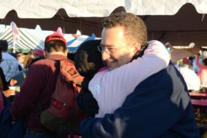 Dr. Israeli embraces a woman at Making Strides of Long Island 2012