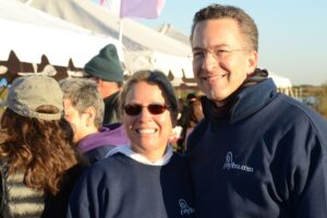 Dr. Israeli stands with a woman in sunglasses at Making Strides of Long Island 2012