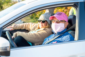 Couple with masks in car at Making Strides 2020 Drive Through photo