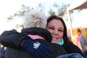 Two woman hugging at Making Strides of Long Island 2013
