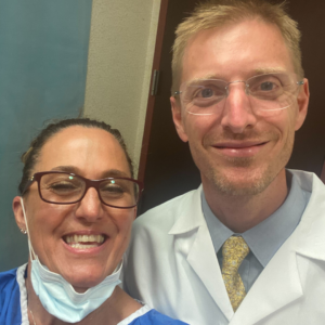 Dr. Peter Korn and patient Gina at the NYBRA Plastic Surgery office