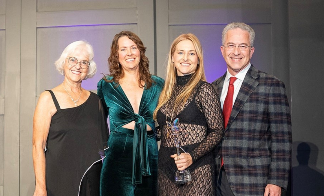 Chelsey accepting award